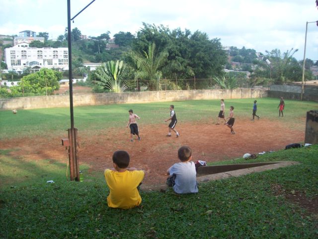 Joshua and Jonah watching the big kids play soccer