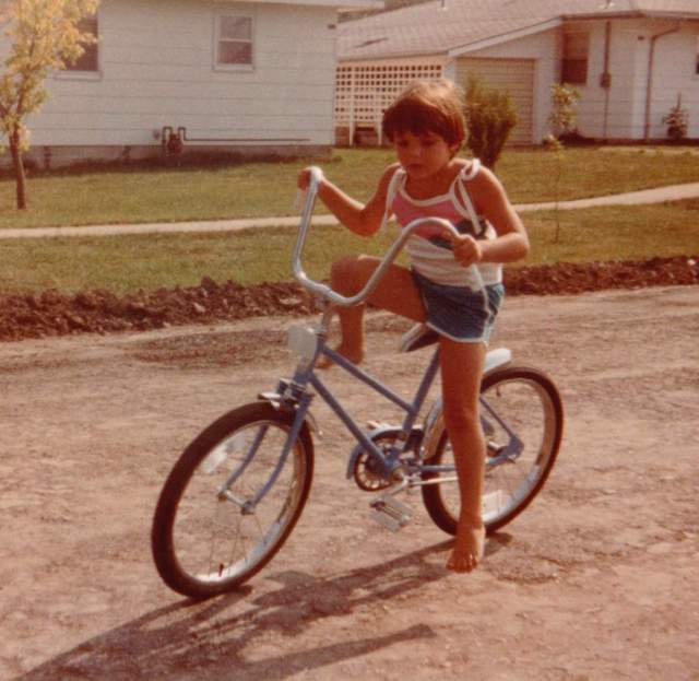 DeAnna as a girl on bike